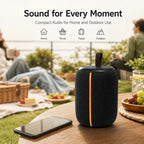 BEEVVOS KMS258 compact portable Bluetooth speaker displayed in a home desktop listening environment.